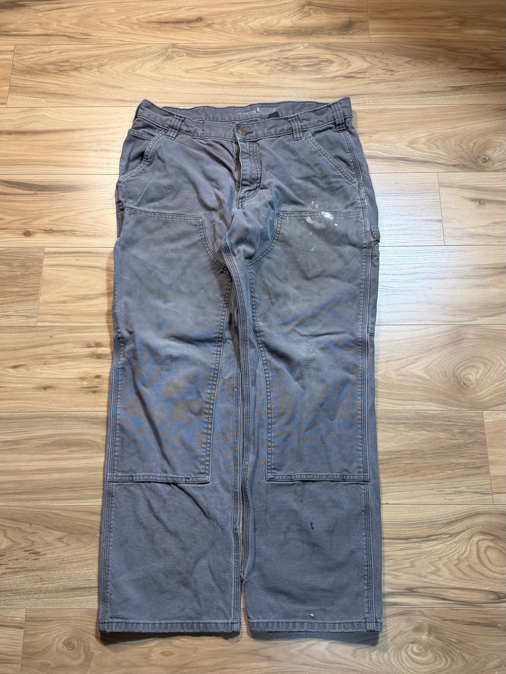 Gray Carhartt Double knee carpenter pants with paint splatters